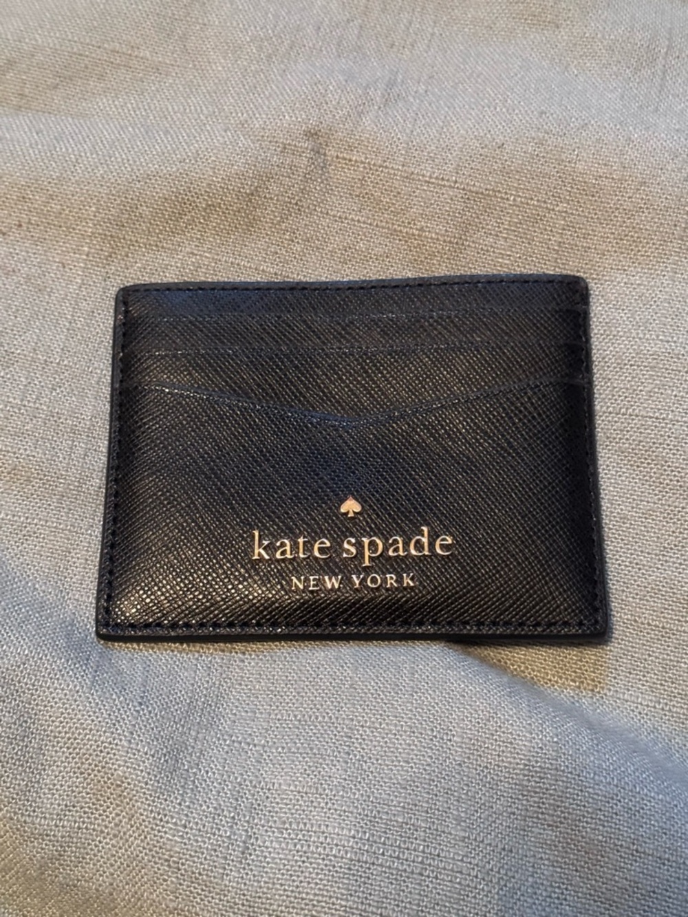 kate spade black leather slim card case with gold logo